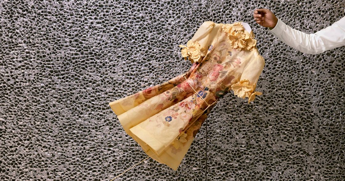 A Person Holding A Bag Of Trash