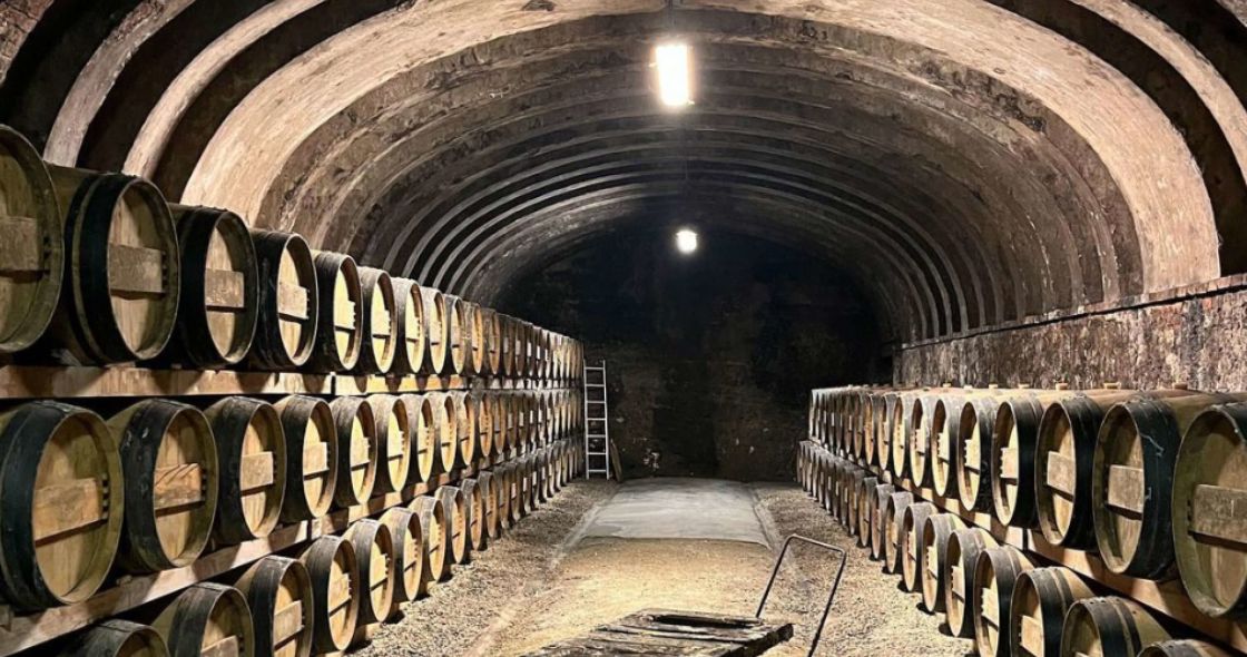 A Large Room With Rows Of Barrels