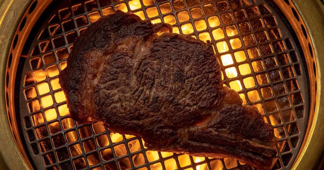 A Piece Of Meat On A Grill