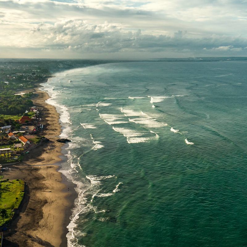 A Beach With Houses And Trees Image