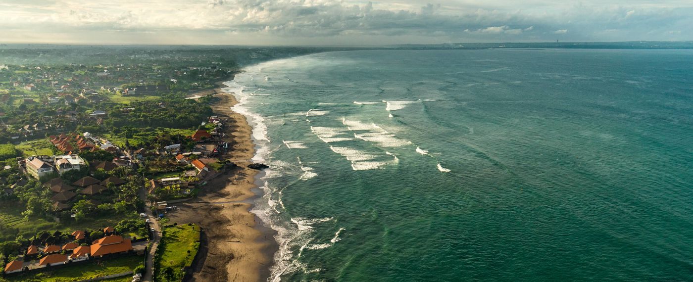A Beach With Houses And Trees
