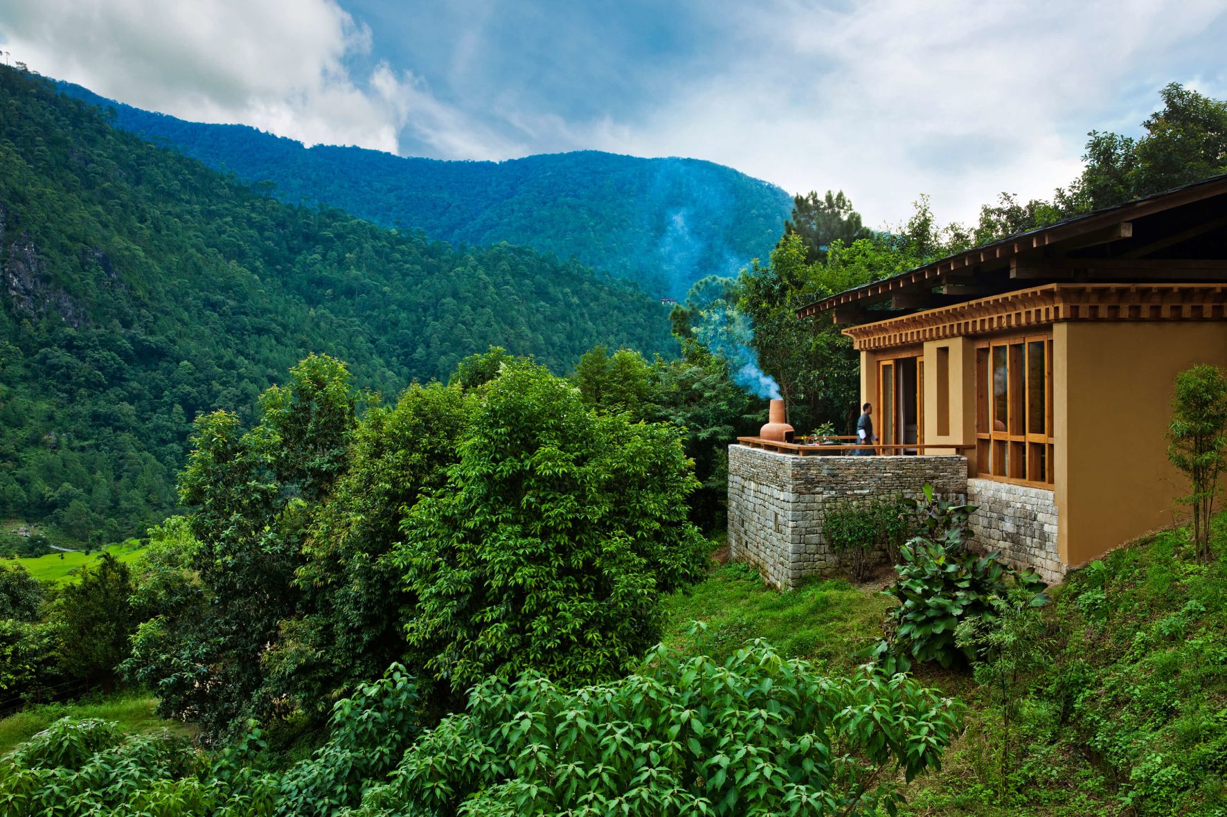 A House With A Large Hill In The Background