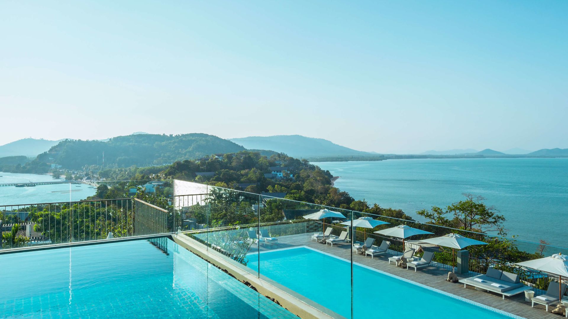 A Pool With A Building In The Background
